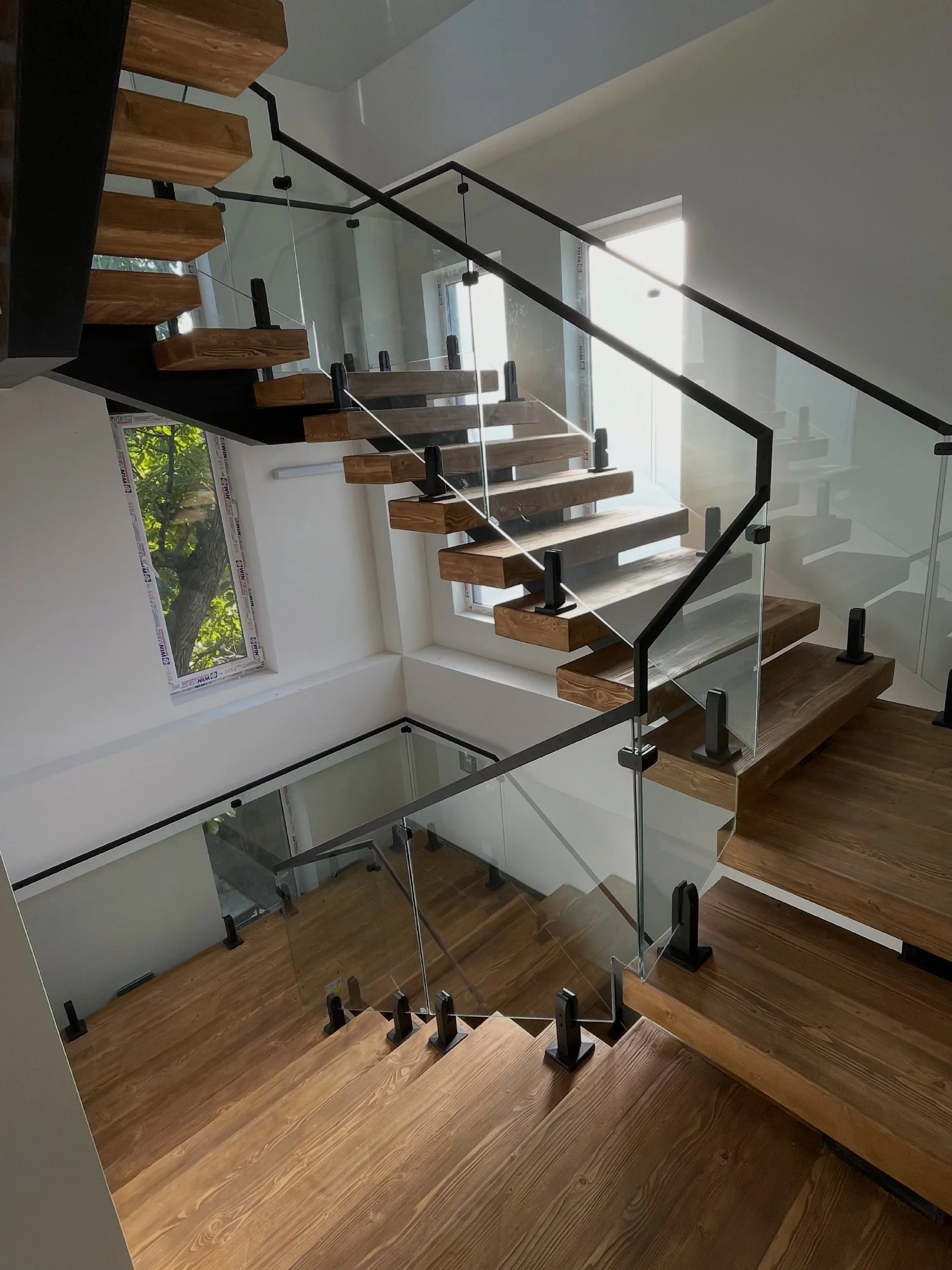 Glass railings up three flights