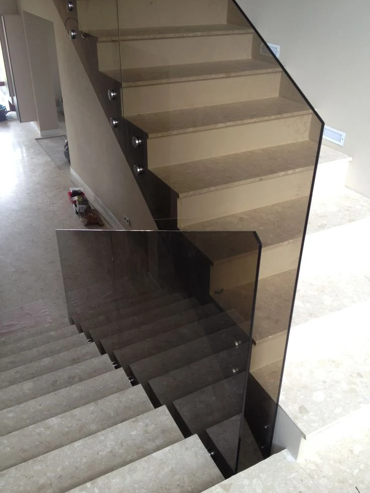 Tinted glass along a stone staircase